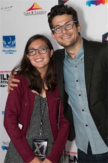 Danielle Stolz, director of Anaerobe and Wings of Peace, smiles for the camera with Jacob Soboroff.